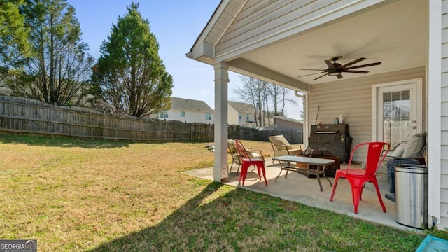 view of yard featuring fence private yard, a patio, and ceiling fan