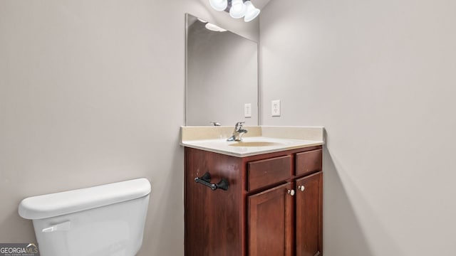 half bath with toilet and vanity