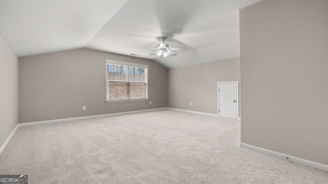 bonus room with carpet flooring, baseboards, a ceiling fan, and lofted ceiling