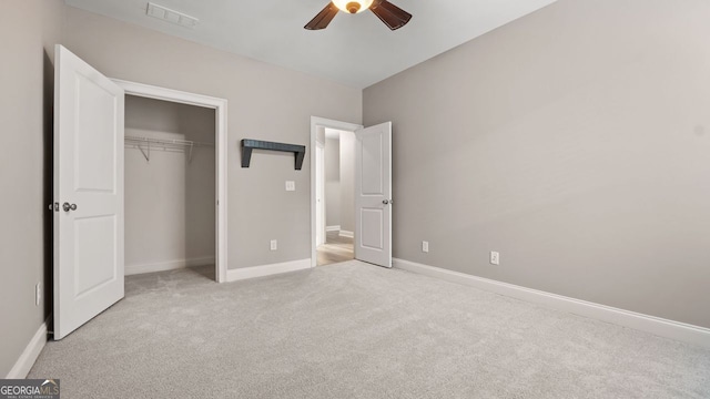 unfurnished bedroom featuring visible vents, a closet, baseboards, and carpet floors