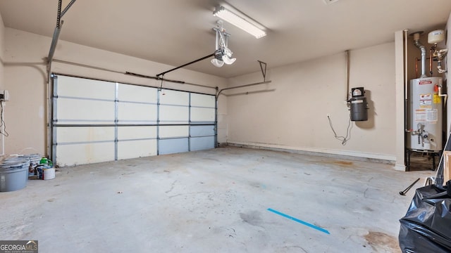 garage with a garage door opener and gas water heater