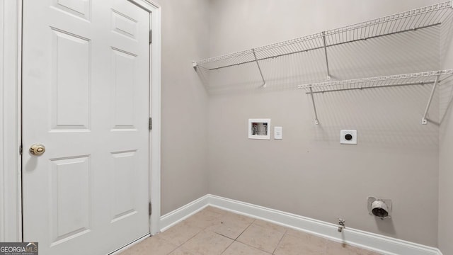 clothes washing area with hookup for a washing machine, laundry area, hookup for an electric dryer, hookup for a gas dryer, and baseboards