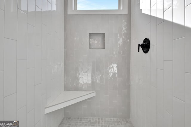 full bathroom with tiled shower