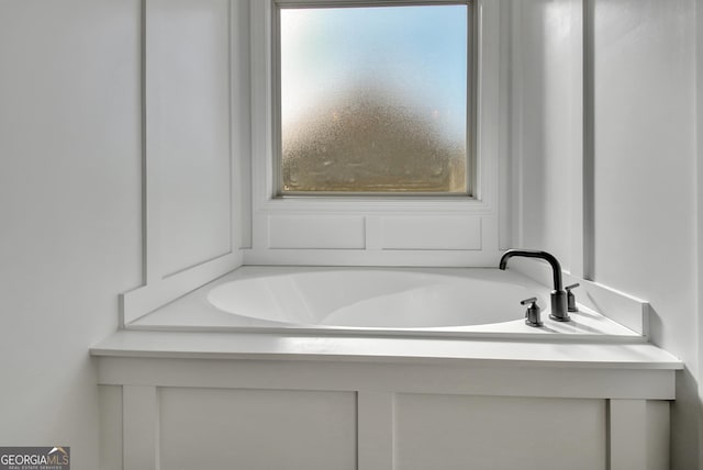 bathroom featuring a garden tub