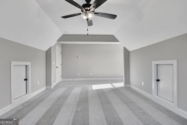 bonus room featuring vaulted ceiling, carpet flooring, a ceiling fan, and baseboards