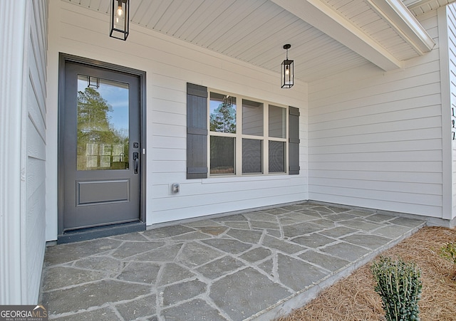 doorway to property featuring a porch