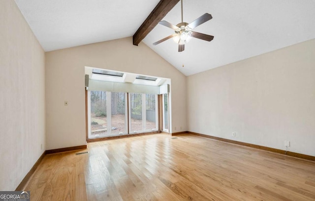 empty room with vaulted ceiling with beams, light wood-type flooring, and baseboards