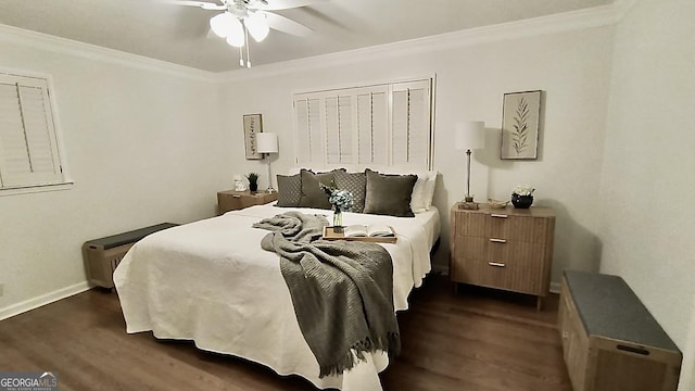 bedroom featuring baseboards, dark wood-style flooring, and crown molding