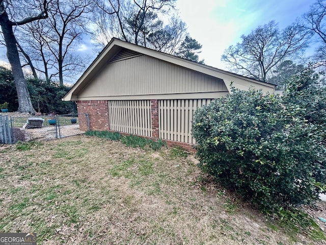 detached garage with fence and a gate