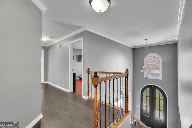 foyer entrance with plenty of natural light, baseboards, dark wood-style flooring, and french doors