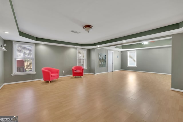 unfurnished room with visible vents, baseboards, wood finished floors, and recessed lighting