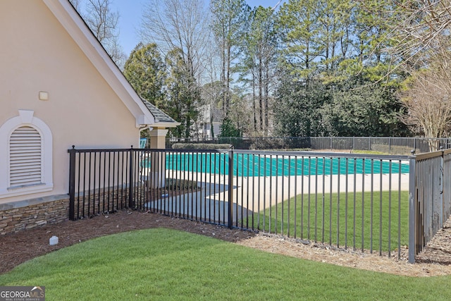 view of pool with a fenced in pool, a patio area, a yard, and fence