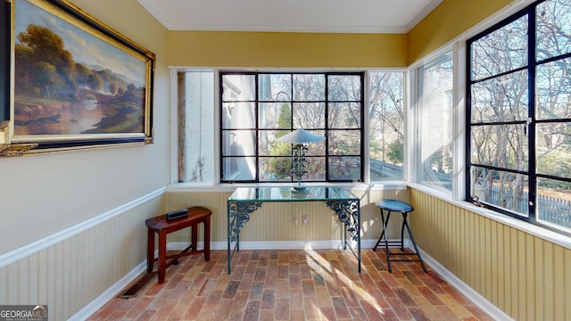 sunroom / solarium with a healthy amount of sunlight and visible vents