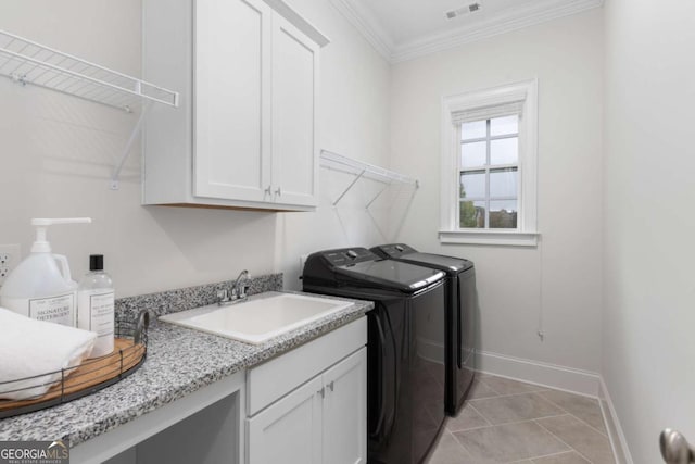 laundry room with visible vents, independent washer and dryer, ornamental molding, a sink, and cabinet space