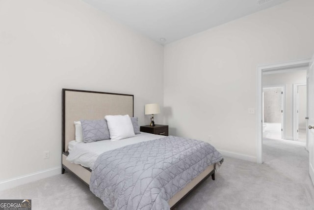 carpeted bedroom featuring baseboards