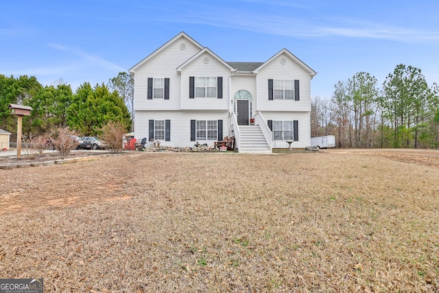 bi-level home featuring a front yard