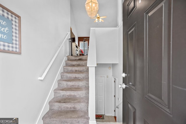 stairs featuring baseboards