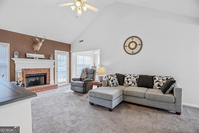 living area featuring carpet floors, a fireplace, visible vents, a ceiling fan, and high vaulted ceiling