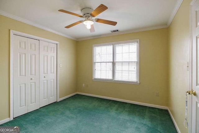 unfurnished bedroom with baseboards, visible vents, crown molding, carpet floors, and a closet