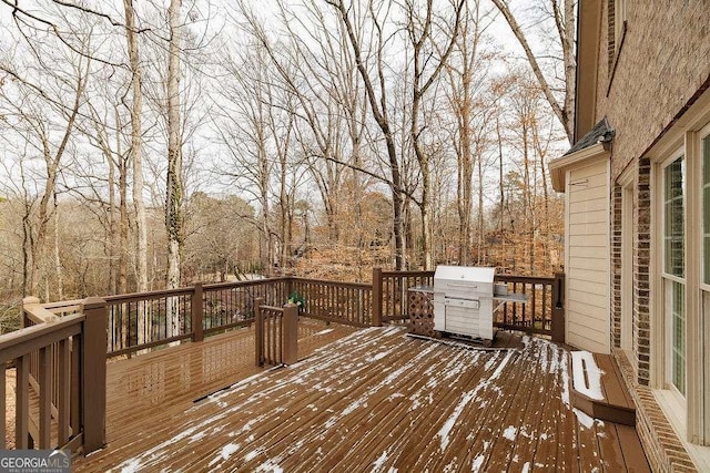 snow covered deck with grilling area