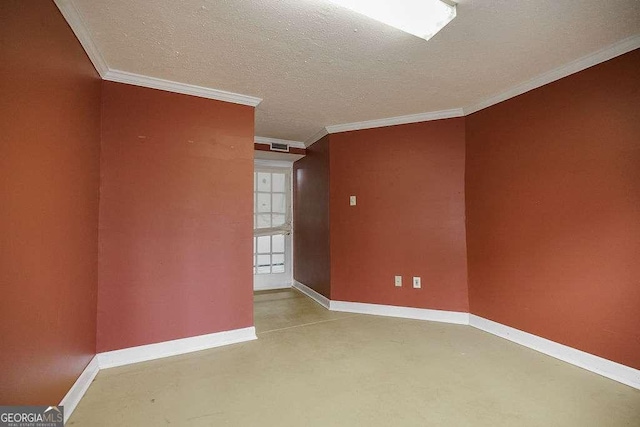unfurnished room featuring concrete flooring, crown molding, a textured ceiling, and baseboards