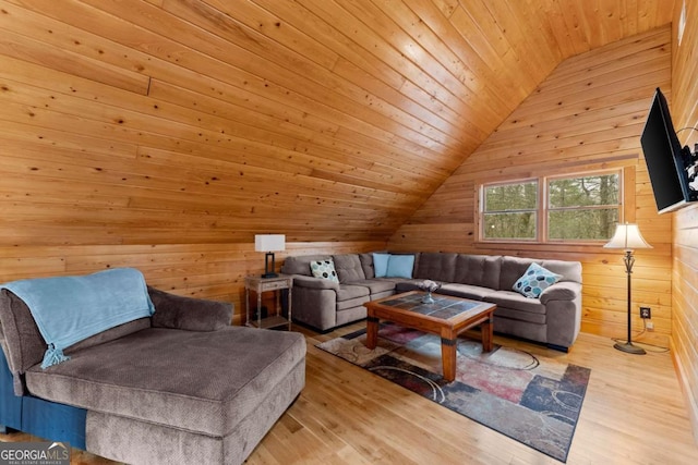 living room featuring wooden ceiling, vaulted ceiling, wood walls, and wood finished floors