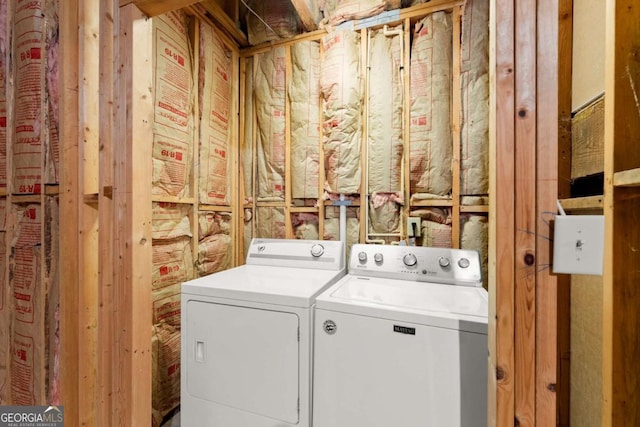 washroom featuring separate washer and dryer and laundry area