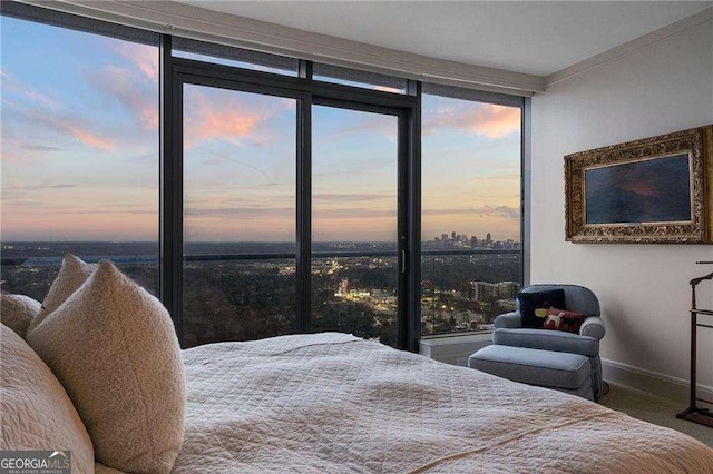 bedroom featuring multiple windows and baseboards