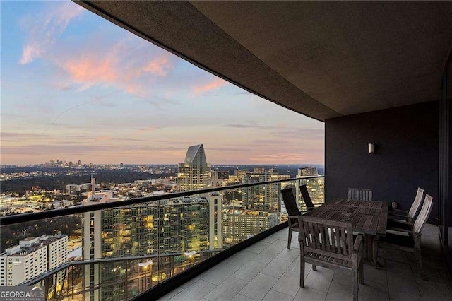 balcony at dusk with a city view