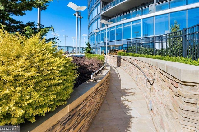 view of property's community with fence