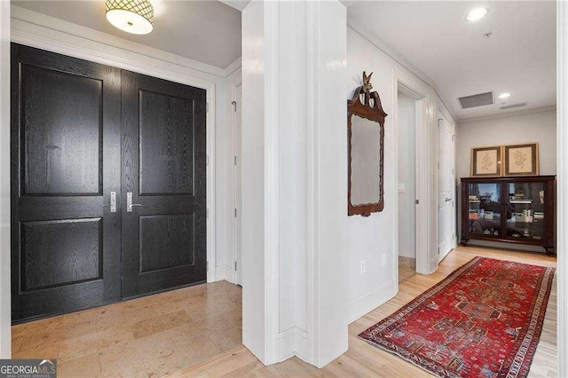 interior space featuring recessed lighting, baseboards, and wood finished floors