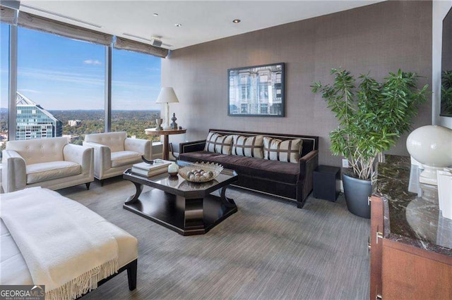 living area featuring floor to ceiling windows