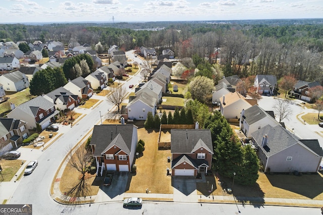 birds eye view of property with a residential view