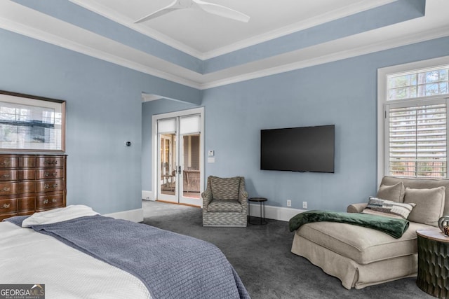 bedroom with carpet floors, a raised ceiling, and crown molding