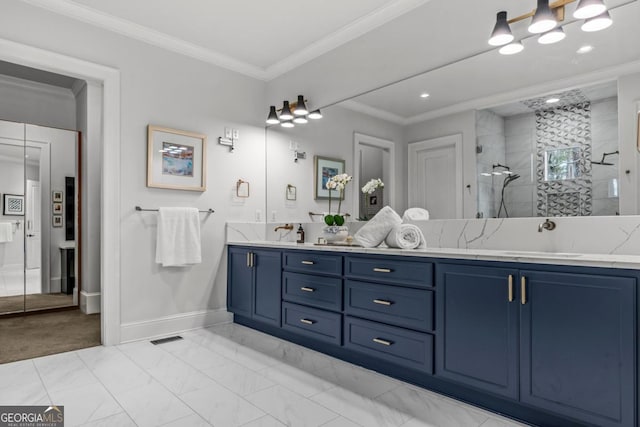 full bath featuring a sink, marble finish floor, walk in shower, and crown molding