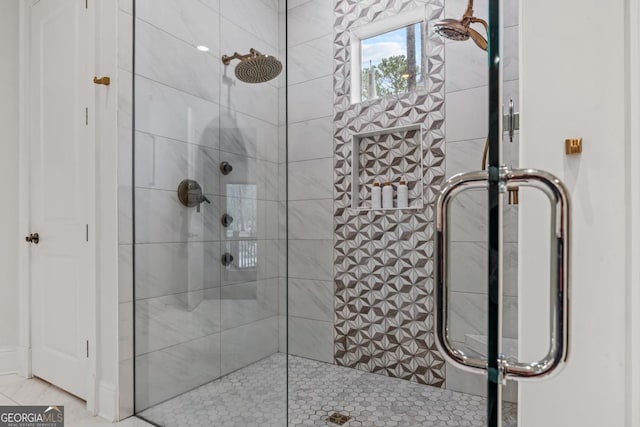 bathroom with a shower stall