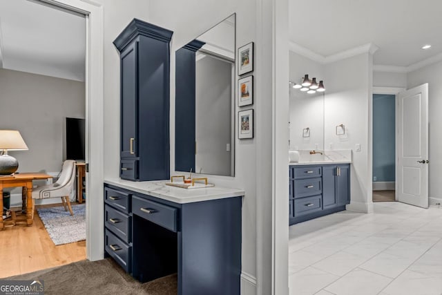 full bath featuring ornamental molding, vanity, and baseboards