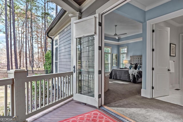 wooden terrace featuring a ceiling fan