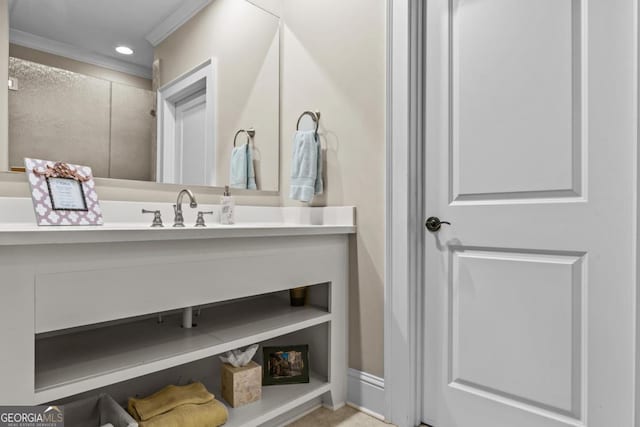 bathroom featuring recessed lighting, crown molding, and vanity