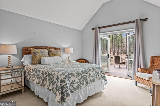 carpeted bedroom featuring lofted ceiling and access to outside