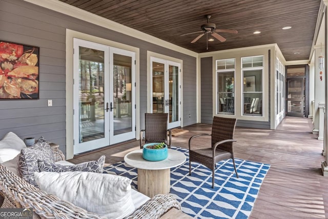 wooden terrace with french doors and a ceiling fan