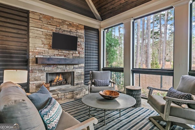 sunroom / solarium with wooden ceiling, a fireplace, and vaulted ceiling