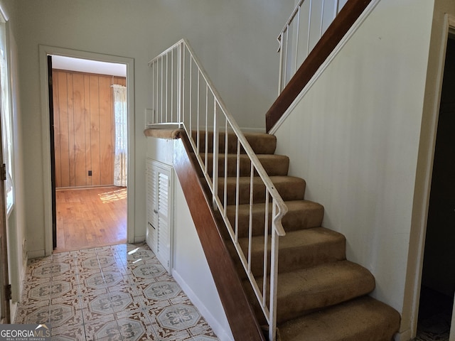 staircase with tile patterned flooring