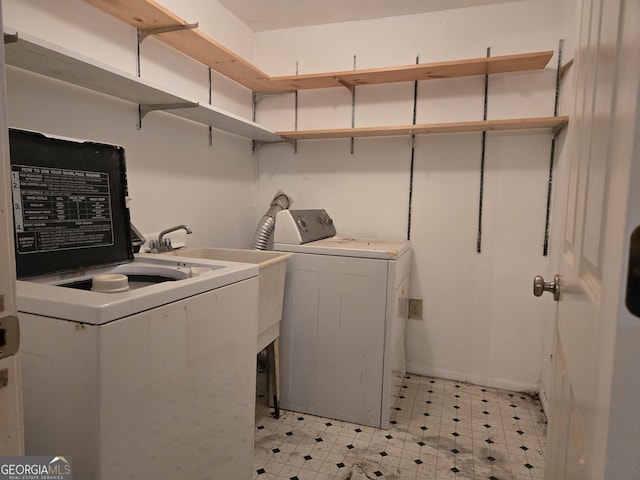 laundry area featuring laundry area, light floors, and washing machine and dryer