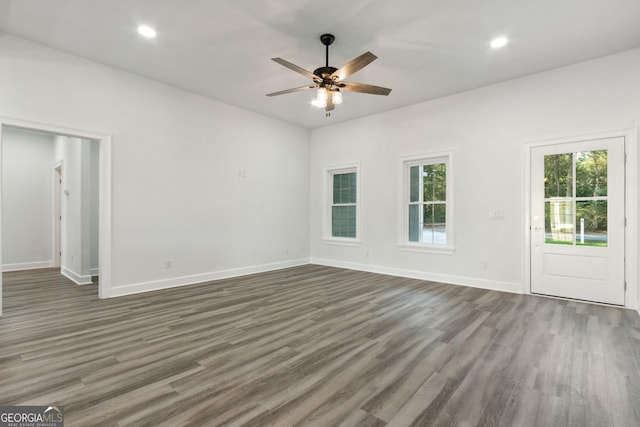 unfurnished room featuring recessed lighting, baseboards, dark wood-type flooring, and ceiling fan