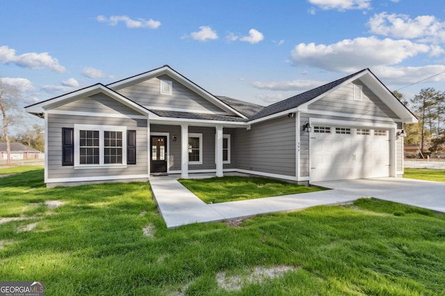 view of front of house featuring roof with shingles, a porch, an attached garage, a front lawn, and concrete driveway