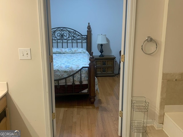 bedroom with wood finished floors