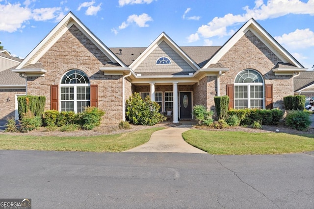 view of front of home featuring brick siding