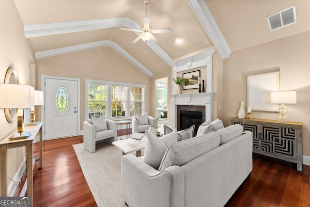 living room featuring dark wood-style floors, ceiling fan, a fireplace, and visible vents