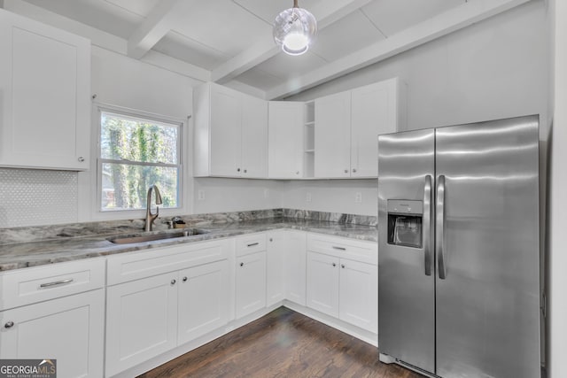 kitchen with open shelves, white cabinets, a sink, light stone countertops, and stainless steel fridge with ice dispenser